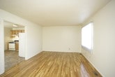 This two-story space is thoughtfully arranged across two distinct floors, offering a natural division between communal and private areas. The multi-level layout provides an inherent sense of organization, with living and gathering spaces typically found on the main floor, while the upper level offers more secluded quarters. The staircase serves as a functional connector between the two floors, contributing to the overall flow of the space. Without sacrificing cohesion, the dual-floor design allows residents to enjoy clearly defined zones for different activities throughout the day. The overall ambiance benefits from the vertical dimension that a two-story layout provides, lending the space a sense of depth and architectural interest that single-level spaces may lack.
