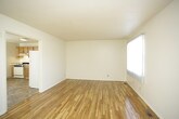 This two-story space is thoughtfully arranged across two distinct floors, offering a natural division between communal and private areas. The multi-level layout provides an inherent sense of organization, with living and gathering spaces typically found on the main floor, while the upper level offers more secluded quarters. The staircase serves as a functional connector between the two floors, contributing to the overall flow of the space. Without sacrificing cohesion, the dual-floor design allows residents to enjoy clearly defined zones for different activities throughout the day. The overall ambiance benefits from the vertical dimension that a two-story layout provides, lending the space a sense of depth and architectural interest that single-level spaces may lack.