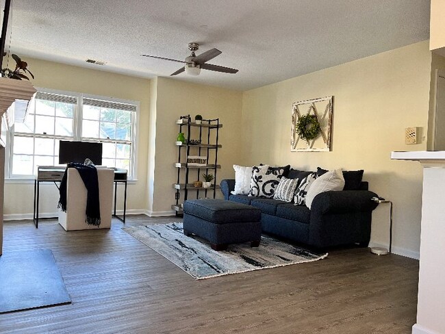 Living room view from dining area. - 704 Rapidan River Ct