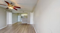 Located at 502 Southwest Pkwy in College Station, TX, this single-story 2-bedroom, 1-bathroom unit offers a practical and comfortable layout. Light wood-style flooring runs throughout the home, lending a clean, cohesive look to every room. The open living area is bright and airy, with a ceiling fan overhead and a window that allows natural light to pour in, offering a view of the outdoor patio. The kitchen is efficiently designed with white cabinetry, dark granite-style countertops, a full suite of white appliances including a refrigerator and electric range, and a peninsula breakfast bar that connects the kitchen to the living space. Both bedrooms feature ceiling fans, neutral-toned walls, and windows that bring in natural light, creating comfortable, versatile spaces. The primary bedroom is generously sized and includes access to a walk-in closet equipped with built-in shelving and hanging rods for ample storage. The bathroom features a tiled shower-tub combo with clean white finishes. Textured ceilings are present throughout the unit. The overall ambiance is light, neutral, and move-in ready, making this a well-suited home in the heart of College Station.