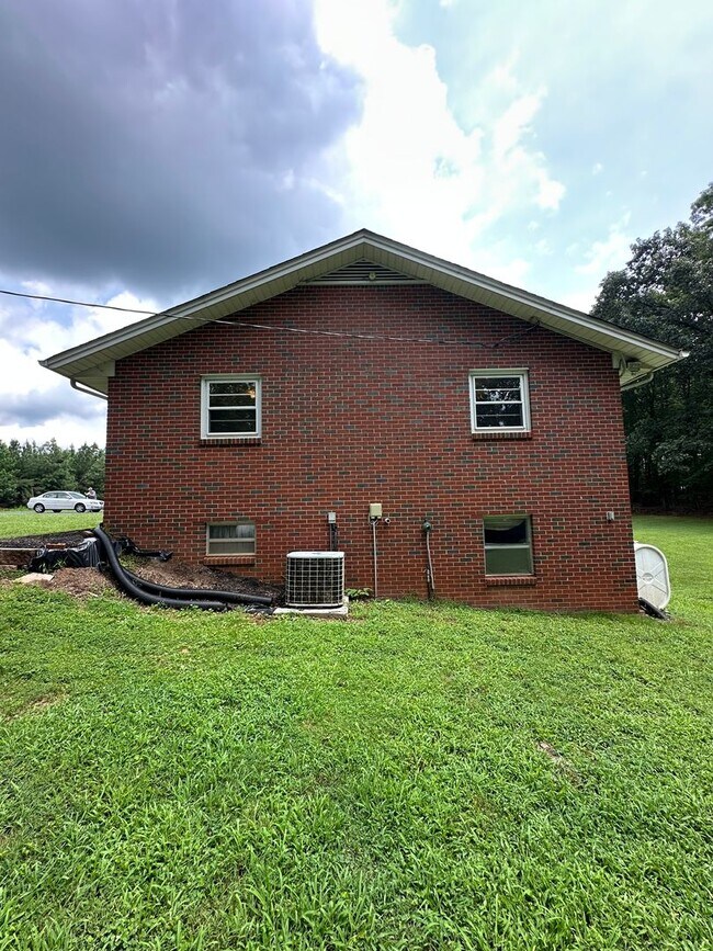 Building Photo - Spacious brick house with a caport and unf...