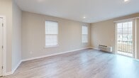 Located at 100 Blenheim Erial Rd in Blackwood, NJ, this well-appointed 2-bedroom, 3-bathroom residence offers a thoughtfully designed single-floor layout with modern finishes throughout. The open-concept kitchen and living area serves as the heart of the home, featuring light wood-style flooring, recessed lighting, and a large kitchen island with a double stainless steel sink and crisp white countertops. The kitchen is equipped with stainless steel appliances including a gas range, built-in microwave, refrigerator, and dishwasher, complemented by two-tone cabinetry in a soft taupe finish. The living area flows naturally from the kitchen and receives ample natural light through a sliding glass door fitted with vertical blinds. The spacious primary bedroom features plush carpeting, neutral walls, and dual windows that bring in natural light. The second bedroom is equally comfortable, also carpeted and bright. Three well-appointed bathrooms feature tile flooring, modern vanities with white countertops, and clean, neutral finishes. Two hallways provide convenient circulation throughout the residence, and a dedicated closet adds practical storage. The overall aesthetic is clean, contemporary, and move-in ready.
