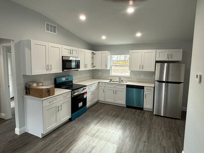 Building Photo - Brand New Designer Home Ready for Family