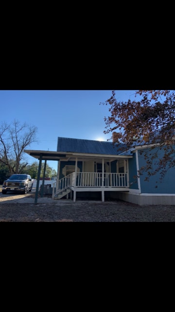 paved parking, covered entry to back patio/back door - 205 E Brumby Ave