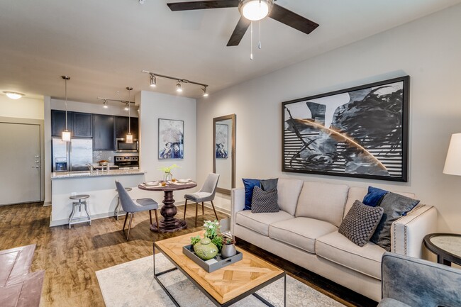 modern living room with wood plank flooring and natural lighting in Plano - Junction 15