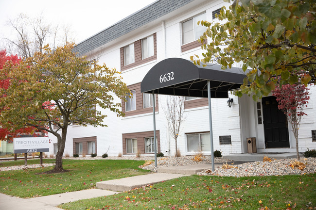 Updated canopy and building exterior. - Treciti Village Apartments