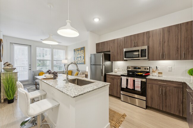 Enjoy cooking and entertaining around our spacious, modern kitchen islands at Latitude Apartments - Latitude