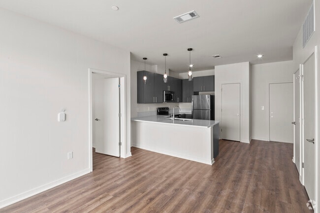Building Photo - The Flats at Carriage Commons