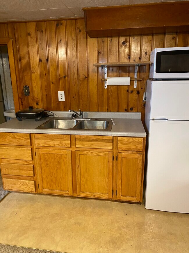 Small kitchen, hot plate, refrigerator - 1402 Broadway N