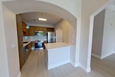 This contemporary apartment in Glendale, CO, offers 99 square meters of thoughtfully designed living space. The layout features two bedrooms and two bathrooms, providing a perfect balance of privacy and shared areas. The open-concept design creates a seamless flow between the living room and kitchen, enhancing the sense of spaciousness.

The kitchen is a standout feature, boasting modern wood cabinetry, stainless steel appliances, and a convenient island that doubles as a breakfast bar. Light-colored quartz countertops complement the overall neutral palette of the space. Large windows in the living areas and bedrooms allow for ample natural light, while vertical blinds offer privacy control.

Both bathrooms are tastefully appointed with modern fixtures, including a combination of tub and shower options. The primary bathroom features a double vanity with ample counter space and a large mirror. Flooring throughout the apartment is a durable, wood-look laminate that adds warmth to the space.

The unit includes an in-unit laundry area with full-sized washer and dryer, eliminating the need for communal laundry facilities. Multiple closets, including walk-ins, provide generous storage options throughout the apartment.

The neutral color scheme, primarily in shades of white and light gray, creates a blank canvas for personal decorating styles. Crown molding adds a touch of elegance to the rooms. With its modern amenities and thoughtful design, this apartment offers a comfortable and stylish living environment in a prime Glendale location.