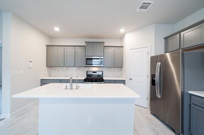 Foto del edificio - 8208 Cottage Rose Dr