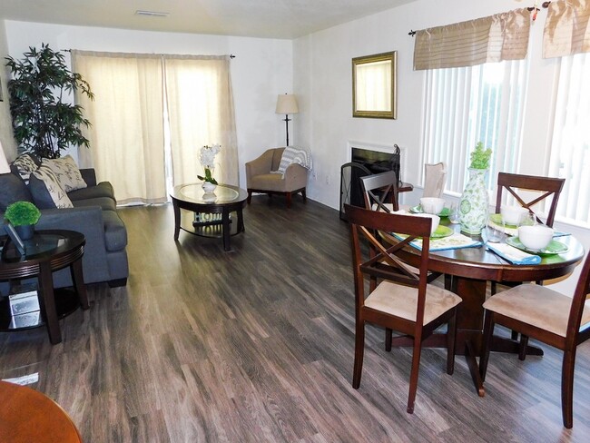 Open Concept Living and Dining Room - River Oaks Apartments & Townhomes