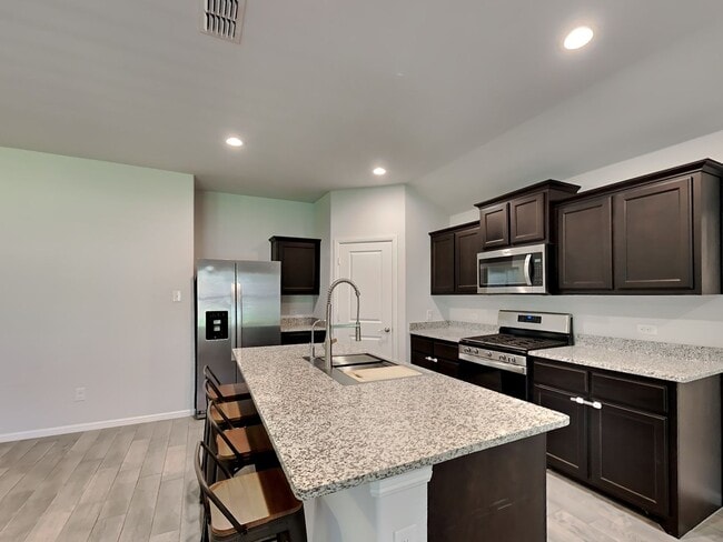 Foto del edificio - Chapel Creek Beauty with Designer Kitchen, Spacious Layout & Private Backyard Retreat!