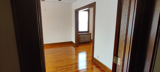 2. View from Foyer: Living Room - 1114 S Long Ave