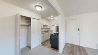 Located at 2759 Granada Dr in Jackson, MI, this single-floor unit offers three bedrooms, one bathroom, and a thoughtfully arranged layout that maximizes its compact footprint. The interior features a clean, neutral color palette with white walls and textured ceilings throughout.

The galley-style kitchen is efficiently designed, featuring white cabinetry with modern hardware, light stone-look countertops, a double-basin sink, a gas range with a stainless steel exhaust hood, and a refrigerator. Light wood-look flooring runs through the kitchen and entry areas, providing a durable, easy-to-maintain surface.

The bedrooms are carpeted and bright, each benefiting from natural light via blinds-equipped windows. The primary bedroom is the most spacious of the three and includes a louvered bi-fold closet. Additional bedrooms also feature louvered closets with hanging rods. One room opens via a sliding glass door to a private outdoor deck with exterior views.

The bathroom is finished with wood-look flooring, a white vanity with granite-style countertop, and a full tub-shower combination. Throughout the unit, flush-mount ceiling fixtures provide consistent lighting, and HVAC vents ensure climate control in each room.