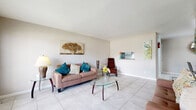 Located at 6833 Beechnut St in Houston, TX, this single-floor, one-bedroom, one-bathroom unit offers a thoughtfully laid-out living space finished with light neutral tones throughout. Large-format tile flooring extends across every room, creating a clean and cohesive look that is both practical and visually open.

The living room is generously sized, bathed in natural light from a broad front-facing window, and features a pass-through shelf that connects to the dining area — a functional design detail that enhances the sense of openness. The dining area flows naturally from the living space, keeping the common areas well-connected.

The galley-style kitchen is efficiently designed, featuring gray cabinetry, granite countertops, a tile backsplash, and black appliances including a range and refrigerator. A dedicated pantry adds valuable storage. Multiple closets throughout the unit further maximize organization.

The spacious primary bedroom includes a ceiling fan with light fixture and a window that brings in natural light, offering a comfortable and airy retreat. The full bathroom is well-appointed with large-format wall tile surrounding a soaking tub and shower combination.

With five closets and a practical single-level layout, this unit in Houston's 77074 corridor provides efficient, functional living in a clean, move-in ready space.