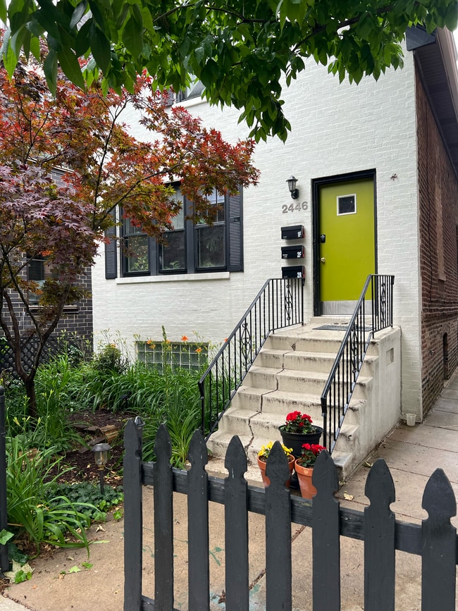 summertime view of front house of property - 2446 W Thomas St