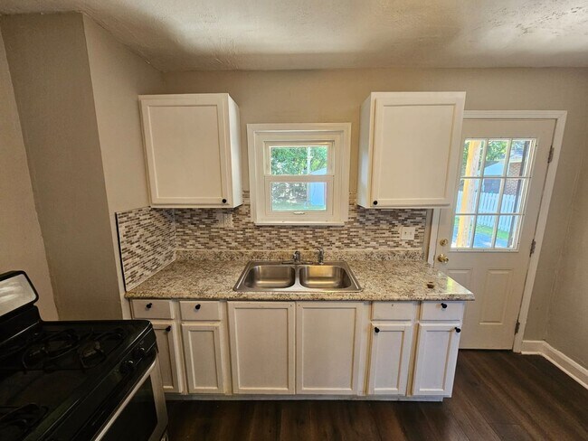 Building Photo - Spacious 4-Bedroom Cleveland Home with Updated Flooring & 2-Car Garage