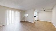Located at 6131 N 27th Ave in Phoenix, Arizona, this 2-bedroom, 2-bathroom single-floor residence offers a well-organized and efficiently designed layout. The open-concept living and dining area is bright and airy, featuring light wood-style flooring, neutral beige walls, and a textured ceiling. A large sliding glass door fitted with vertical blinds allows natural light to fill the space and provides outdoor access. A convenient pass-through shelf connects the living area to the kitchen, enhancing the open feel.

The kitchen is outfitted with white cabinetry, light countertops, stainless steel appliances including a range and refrigerator, and a skylight that brings in additional natural light — making it both functional and inviting.

The primary bedroom offers a comfortable footprint with a sliding-door closet and a window with blinds for natural light. A second bedroom provides similar features with access to its own bathroom. Both bathrooms are finished in a clean, neutral palette with light flooring, white vanity cabinetry, and shower/tub combinations. A hallway connects the bedrooms and bathrooms, with a dedicated closet providing additional storage. The consistent use of light tones and wood-style flooring throughout creates a cohesive and clean aesthetic.
