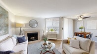 Located in Sacramento's Pocket neighborhood, this single-floor, 3-bedroom, 2-bathroom home offers a well-designed layout with a clean, modern aesthetic. The inviting living room is a standout, featuring a tile-surround fireplace, crown molding, and light wood flooring, with large windows and a sliding glass door that fill the space with natural light. The kitchen is thoughtfully updated with white shaker cabinetry, subway tile backsplash, gray quartz countertops, stainless steel appliances, and a peninsula that opens toward the dining area — ideal for both everyday living and entertaining. The primary bedroom offers carpeted flooring, a large window with natural light, and access to a full bathroom featuring a wide vanity with white cabinetry, gray countertops, and a tub-shower combination. A second full bathroom mirrors the same clean, updated styling with wood-look flooring and a well-lit vanity mirror. The two additional bedrooms are comfortably sized with neutral carpet and windows providing natural light. Two closets provide practical storage throughout. The home's consistent use of light tones, hardwood-style flooring in common areas, and updated finishes create a cohesive and welcoming atmosphere from room to room.
