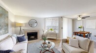 Located in Sacramento's Pocket neighborhood, this single-floor, 3-bedroom, 2-bathroom home offers a well-designed layout with a clean, modern aesthetic. The inviting living room is a standout, featuring a tile-surround fireplace, crown molding, and light wood flooring, with large windows and a sliding glass door that fill the space with natural light. The kitchen is thoughtfully updated with white shaker cabinetry, subway tile backsplash, gray quartz countertops, stainless steel appliances, and a peninsula that opens toward the dining area — ideal for both everyday living and entertaining. The primary bedroom offers carpeted flooring, a large window with natural light, and access to a full bathroom featuring a wide vanity with white cabinetry, gray countertops, and a tub-shower combination. A second full bathroom mirrors the same clean, updated styling with wood-look flooring and a well-lit vanity mirror. The two additional bedrooms are comfortably sized with neutral carpet and windows providing natural light. Two closets provide practical storage throughout. The home's consistent use of light tones, hardwood-style flooring in common areas, and updated finishes create a cohesive and welcoming atmosphere from room to room.
