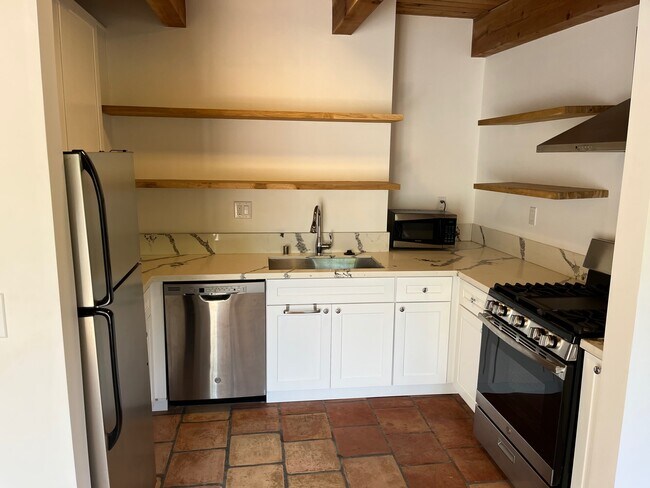 Full kitchen with floating shelves - 2297 Holly Dr