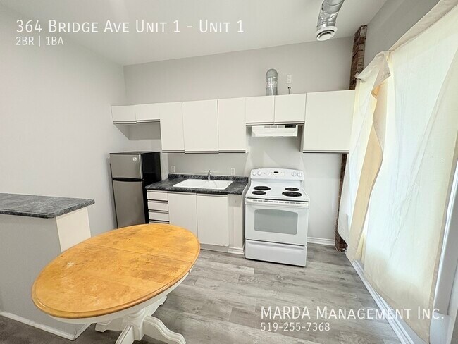 Photo du bâtiment - 2 BEDROOM 1 BATH MAIN FLOOR UNIT - ALL UTI...