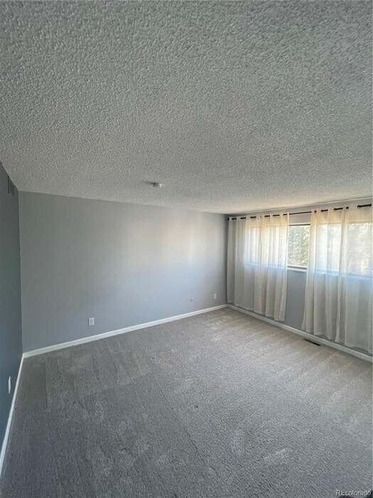 Bedroom with two closets. - 6700 E Mississippi Ave