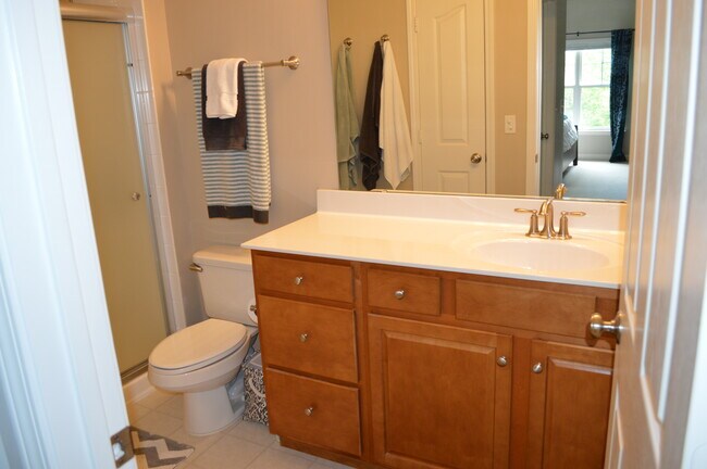 En-suite master bathroom includes large shower with upgraded shower doors. - 19813 Deer Valley Dr