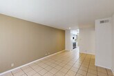 Located at 4200 W 34th Street in Houston, TX, this single-story, 2-bedroom, 1-bathroom home offers a practical and well-organized layout. Light-toned ceramic tile flooring runs throughout the entire home, lending a clean, cohesive look to every room.

The living room is a generously proportioned open space with neutral warm-toned walls, recessed lighting, and a wide window that allows natural light to fill the area. It connects seamlessly to the kitchen, which features dark wood cabinetry, granite countertops, a stainless steel sink, a dishwasher, and a window that brings in additional natural light. A dedicated pantry provides convenient extra storage.

The primary bedroom is a well-sized room equipped with a ceiling fan and light fixture, along with a window for natural ventilation. The second bedroom is comparably comfortable, also featuring tile flooring, a ceiling fan, and a large window. Both bedrooms benefit from access to closets, with three closets total distributed throughout the home.

The bathroom includes a full tub and shower combination with white tile surround, offering a clean and functional design. A hallway connects the living areas to the bedrooms and bathroom, contributing to an efficient floor plan. The overall ambiance of the home is bright, neutral, and move-in ready.