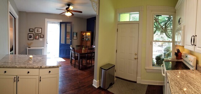 High ceilings, TONS of natural light, intricate woodwork and open floor plan!! - 3722 Stevens Pl