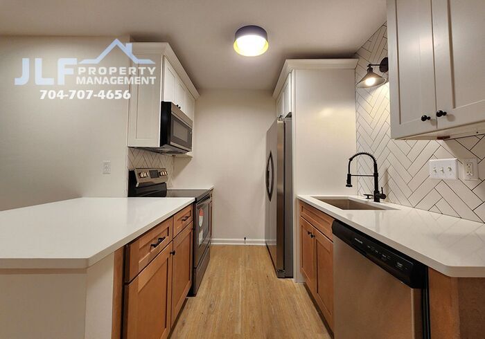 Primary Photo - Freshly Updated 2/2 Duplex with Modern Fix...