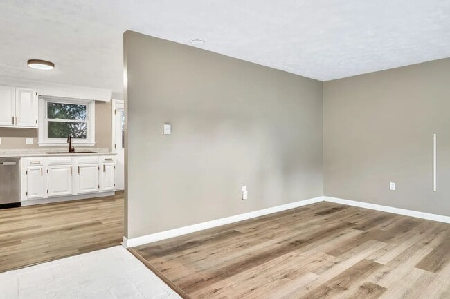 Living room leading to kitchen - 375 Bridgton Rd