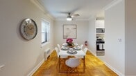 Located at 44 Hill St in Morristown, NJ, this well-appointed 2-bedroom, 2-bathroom residence offers a thoughtfully designed single-floor layout that balances comfort and functionality. Throughout the home, warm parquet hardwood flooring adds a timeless character, complemented by neutral wall tones and crown molding that lend a refined, cohesive aesthetic.

The living room is generously sized, featuring elegant crown molding, natural light from large windows, and ample space for comfortable seating arrangements. Adjacent to the living area, a dedicated dining room provides an ideal setting for entertaining, with windows on multiple sides filling the space with natural light and a ceiling fan overhead.

The kitchen is efficiently designed with modern cabinetry featuring wood-tone accents, sleek quartz-style countertops, and stainless steel appliances including a gas range and over-the-range microwave. It opens directly to the dining area, creating a seamless flow for everyday living.

Both bedrooms are comfortably proportioned, each equipped with ceiling fans, windows with natural light, and the same warm parquet flooring found throughout the home. The two bathrooms are clean and bright, one featuring a tiled walk-in shower and modern vanity, and the other a full bath with a shower/tub combination and large wall mirror.