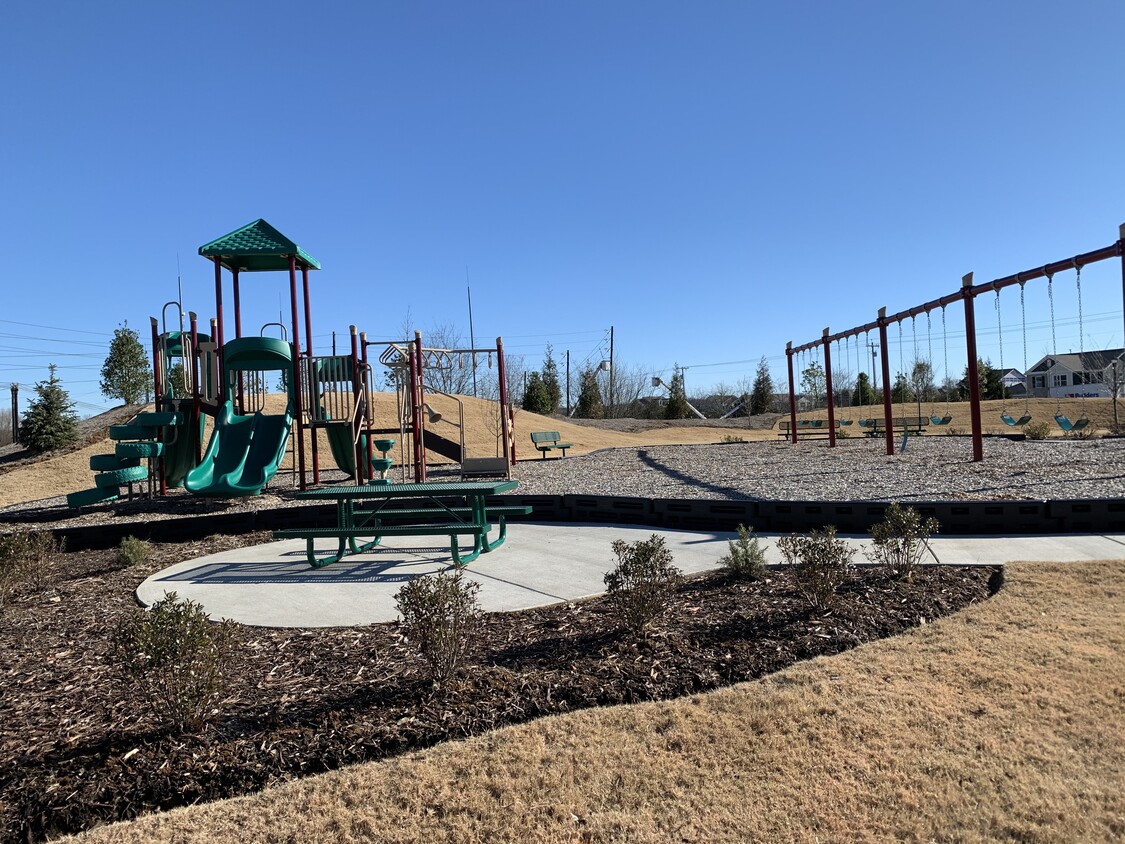 Playground and cook out area with picnic tables at Villages at Hunters Point - 9010 Fenton Rd.