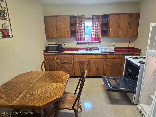 LARGE KITCHEN... SELF-CLEANING STOVE....FULL SIZE REFRIGERATOR WITH PLENTY OF CABINETS! - 1216 University Ave