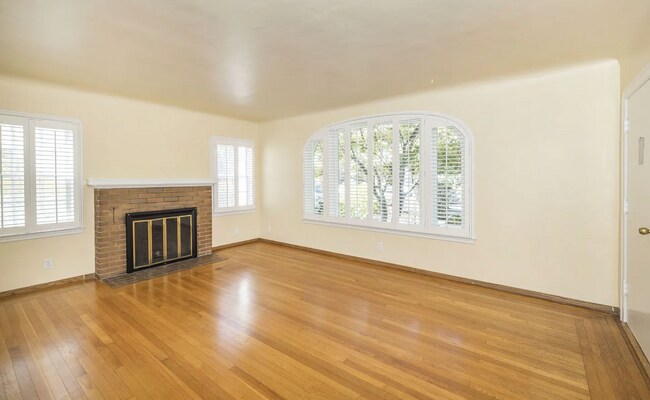 Building Photo - Charming Spanish Style Cottage with Incredible Deck- Gardener's Delight!