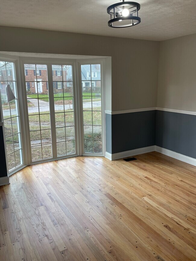 Dining room with an abundance of natural light from the large bay window - 3123 Keswick Rd