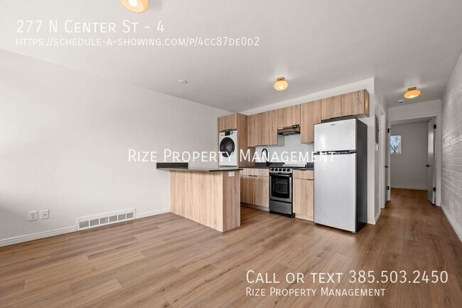 Building Photo - Live at the Center of Modern Conveniences ...