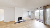 Located on Mayfield Avenue in the sought-after Brentwood neighborhood of Los Angeles, this 2-bedroom, 2-bathroom residence offers a well-designed single-floor layout with a clean, bright aesthetic throughout. Light wood flooring flows continuously across the living spaces, complementing the crisp white walls and textured ceilings that define the interior character.

The open living room serves as the heart of the home, anchored by a striking white brick fireplace with a dark tile hearth — a standout architectural feature. A ceiling fan, wall-mounted AC unit, and sliding glass door leading to the balcony complete the space, which overlooks a courtyard with pool access below.

The kitchen is generously proportioned with a galley-style layout, featuring white cabinetry, granite-style countertops, a tile backsplash, and stainless steel appliances including a refrigerator, dishwasher, and electric range. A ceiling fan and window provide ventilation and natural light.

The spacious primary bedroom offers ample room and includes access to a walk-in closet. The second bedroom is equally well-sized with a natural light window. Both bathrooms are finished with granite-topped vanities and white cabinetry. A hallway connects the private quarters efficiently. The balcony extends the living space outdoors, overlooking a shared courtyard and pool area.