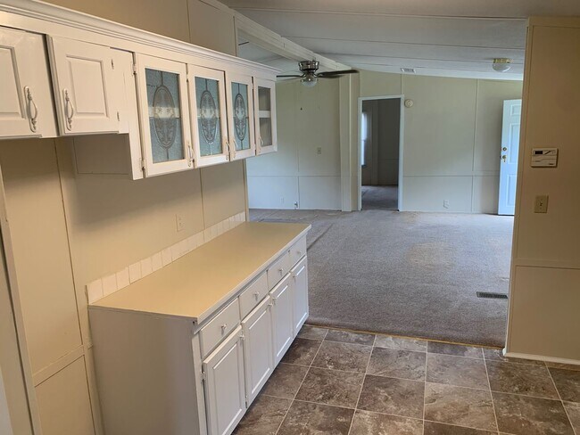 Building Photo - Doublewide Mobile Home on Large Corner Lot