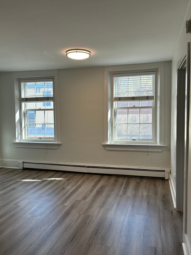 Living room overlooking Water St and post office - 323 Water St