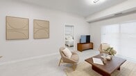 Located at 50 Otterbein Road in Kitchener, Ontario, this well-appointed 2-bedroom, 2-bathroom unit offers a thoughtfully designed single-floor layout with generous living space throughout. The open-concept main area seamlessly connects the kitchen, dining, and living room, creating a bright and welcoming environment enhanced by light-toned luxury vinyl flooring that runs throughout the home. The kitchen is equipped with stainless steel appliances including a fridge, electric range, over-the-range microwave, and dishwasher, complemented by white soft-close cabinetry, grey quartz-style countertops, a subway tile backsplash, and a double undermount sink. The living area is comfortably sized, with natural light filtering in from nearby windows. The primary bedroom is generously proportioned, featuring its own closet and direct access to a private ensuite bathroom. The second bedroom is well-sized with a window that brings in natural light. Both bathrooms feature marble-look tile flooring and walk-in shower enclosures. A dedicated laundry room with open wood shelving and full-sized washer and dryer hookups adds everyday convenience. The unit also includes two closets for additional storage, rounding out a functional and modern living space.