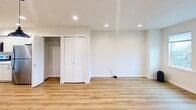 This meticulously designed 1,230 square foot residence in Bellingham, Washington, offers a harmonious blend of comfort and functionality across three floors. The home boasts 3 bedrooms and 3 bathrooms, ensuring ample space and privacy for occupants. The primary bedroom, measuring 150 square feet, provides a generous retreat.

The property's layout includes a garage, two hallways, a utility room, and a well-appointed kitchen that opens to the living room, promoting an open-concept living experience. The staircase connects all three levels, with the ground floor covering 100 square feet, the first floor spanning 590 square feet, and the second floor offering 540 square feet of living space.

Interior finishes showcase a modern aesthetic with crisp white walls, recessed lighting, and a mix of plush carpeting and sleek hardwood flooring. The kitchen features clean lines with white cabinetry, contrasting black hardware, and stainless steel appliances. Bathrooms are outfitted with contemporary fixtures, including illuminated mirrors and stylish vanities.

Large windows throughout the home invite natural light, creating bright and airy spaces. The property also includes two closets for additional storage. With its thoughtful design and prime location at 204 Tull Rd, this home offers a perfect balance of style and practicality for comfortable living in the Pacific Northwest.
