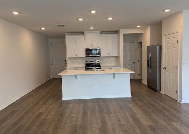 Building Photo - "Spacious 3-Bedroom Townhouse with Granite Elegance in St. Cloud – 4543 Rangeland Way"
