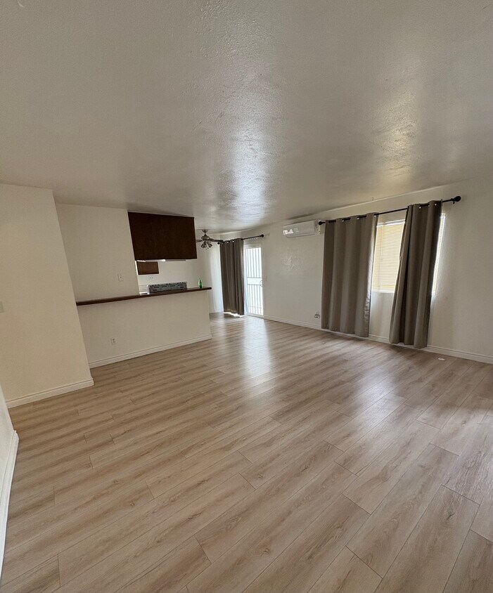 Main entryway, living space and dining space - 18410 Desidia St