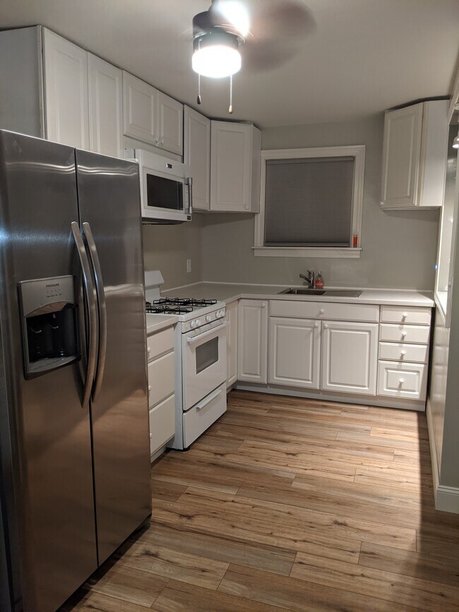 Newly installed cabinetry for all your kitchen utensils. Brand new appliances, microwave and sink. - 413 S Hamilton St