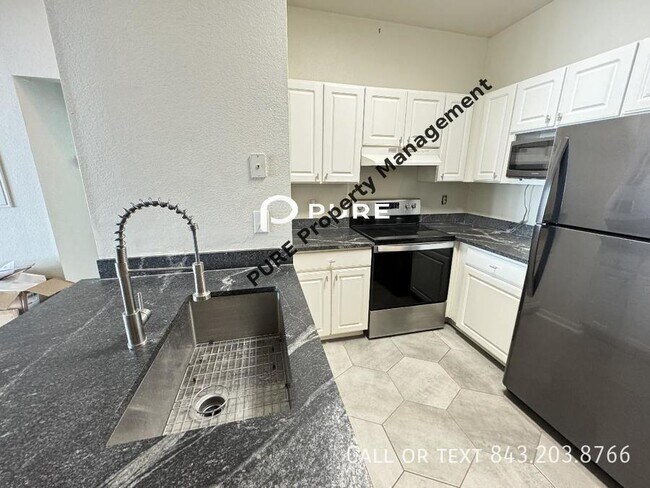 Building Photo - 3 bed FIRST FLOOR ADA condo Available Now ...