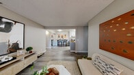 This single-floor residence in Hayward, California offers a thoughtfully designed layout that balances comfort and functionality. The open-concept living and dining area features wood-style plank flooring, neutral-toned walls, and a textured ceiling, creating a warm and inviting atmosphere. A sliding glass door floods the living space with natural light and provides direct access to a private patio, ideal for indoor-outdoor living.

The kitchen is appointed with granite countertops, gray shaker-style cabinetry, stainless steel appliances, and a breakfast bar with seating — a practical and stylish hub for cooking and casual dining. The space flows seamlessly from the kitchen into the main living area.

Two well-proportioned bedrooms are finished with plush carpeting. The primary bedroom features a mirrored sliding closet door and ample natural light from dual windows with views of surrounding greenery. The second bedroom similarly benefits from corner windows that invite natural light.

Both bathrooms are finished with granite-top vanities and gray cabinetry. The primary bathroom includes built-in shelving for added storage, while the second bathroom features a shower-tub combination. Wood-style flooring runs throughout the wet areas, tying the overall aesthetic together cohesively.
