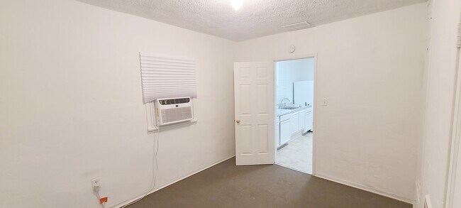 Bedroom 1 off kitchen - 1220 E Ogden Ave